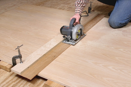 Using a circular saw and jig to cut a panel