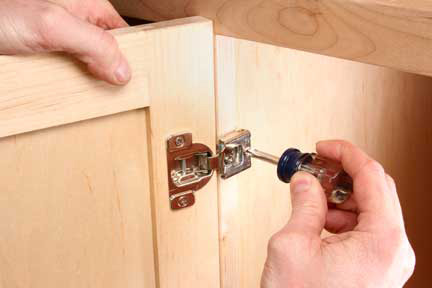 Finishing european hinge installation by adding screws