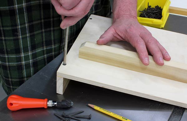 Screwing scrap fence to back of drilling jig