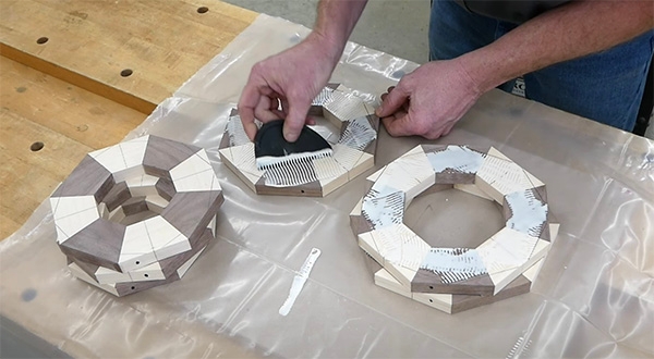 scraping off the excess dry glue