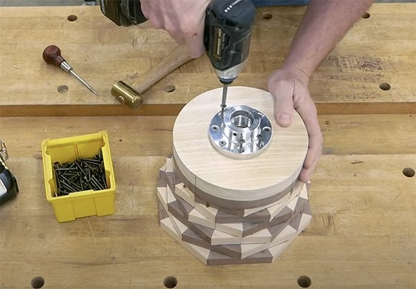 Gluing the bottom round piece and a scrap piece of Poplar to the bottom of the stacked frames and attaching faceplate to the poplar.