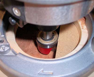 Side view of a dish carving router bit preparing to make a recess cut