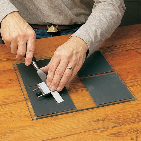 Using a plate glass hand tool sharpening system
