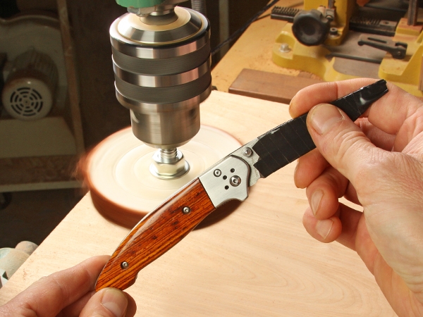 Slipjoint pocket knife with a carved wood handle