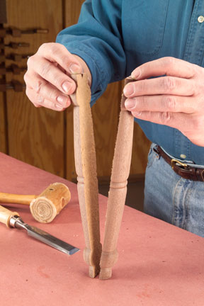 Pulling two halves of a turning split by a glue joint apart.