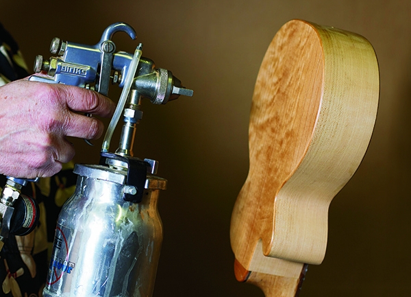 Spraying finish onto a guitar