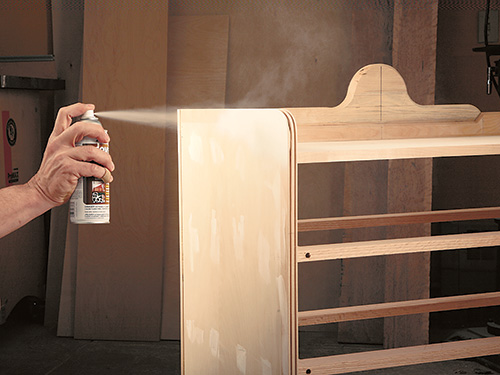 Spraying a finish on a smoothed cabinet case