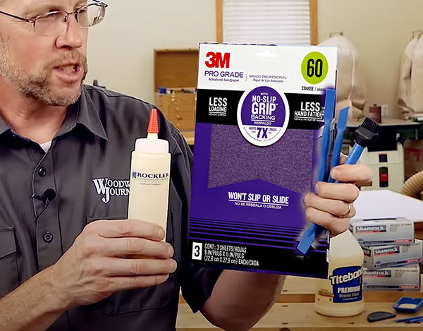man holding workshop supplies