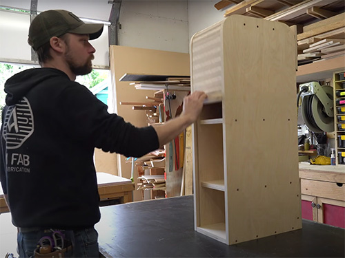 Small cabinet with a plywood roll top
