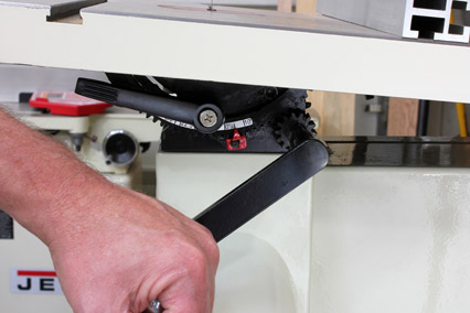 Tilting band saw table to make tapering cuts