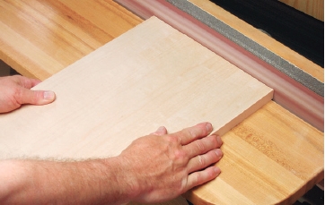 Sanding edging ends flush with an edge sander