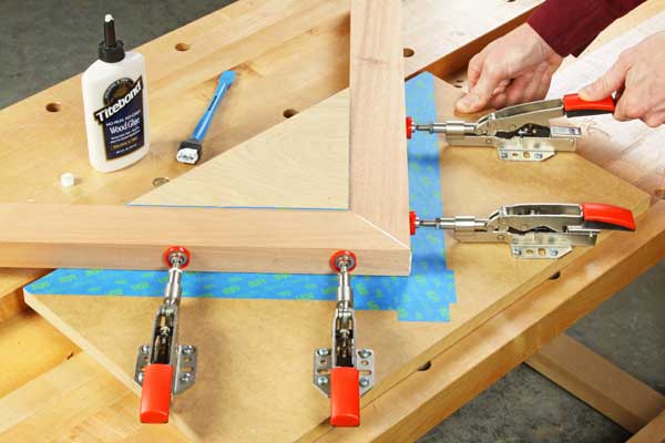 Clamping together a miter joint with toggle clamps