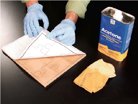 Using acetone to rub puzzle pattern onto panel