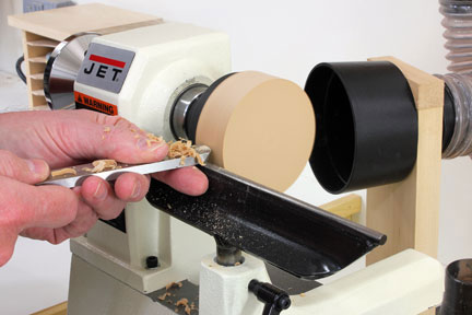 Turning glue block on lathe to true it
