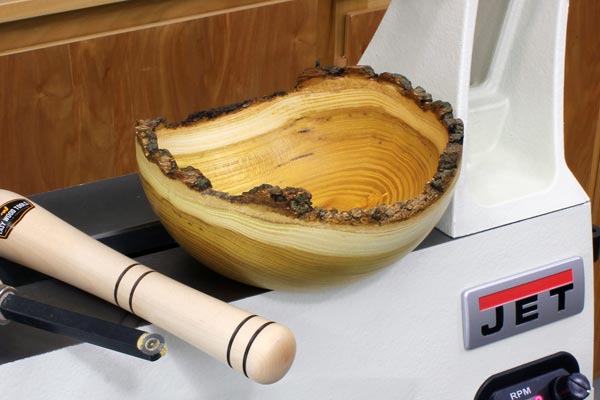 Turned natural edge bowl made from a green blank