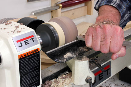 Turning a blank attached to glue block with a chisel