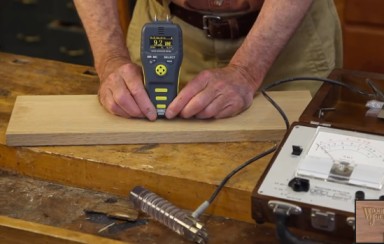 Checking moisture content of wood with a moisture meter
