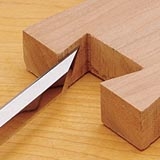 Cutting an angled joint with a beveled chisel