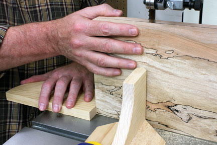 Pushing book-match panel cut with sacrificial block