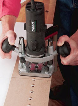 using trim router to drill holes