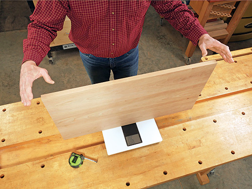 Using digital scale to weigh lid to determine what size hinge to use
