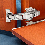 Close-up of a hinge with zero clearance swing