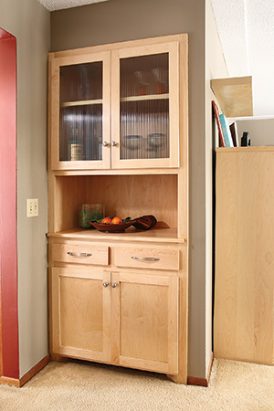 Inset storage cabinet with glass upper doors