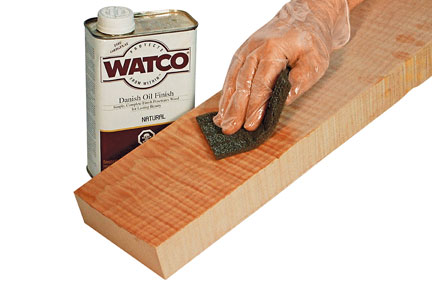 wiping danish oil onto a board
