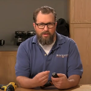 man explaining how to change a drill bit