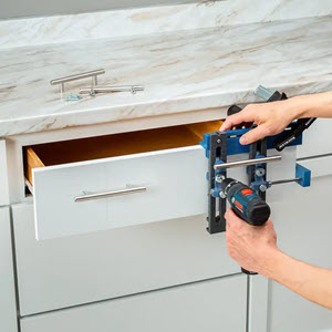 showing use of jig to install cabinet drawer handles