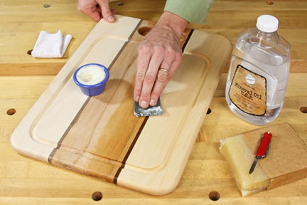 bottle of mineral oil and a cutting board